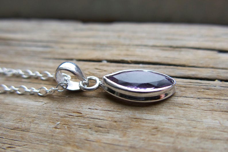 Amethyst pendant necklace: sterling silver bezel, February birthstone, dainty oval-cut stone on a delicate chain.