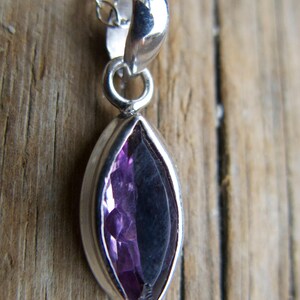 Amethyst pendant necklace: sterling silver bezel, February birthstone, dainty oval-cut stone on a delicate chain.