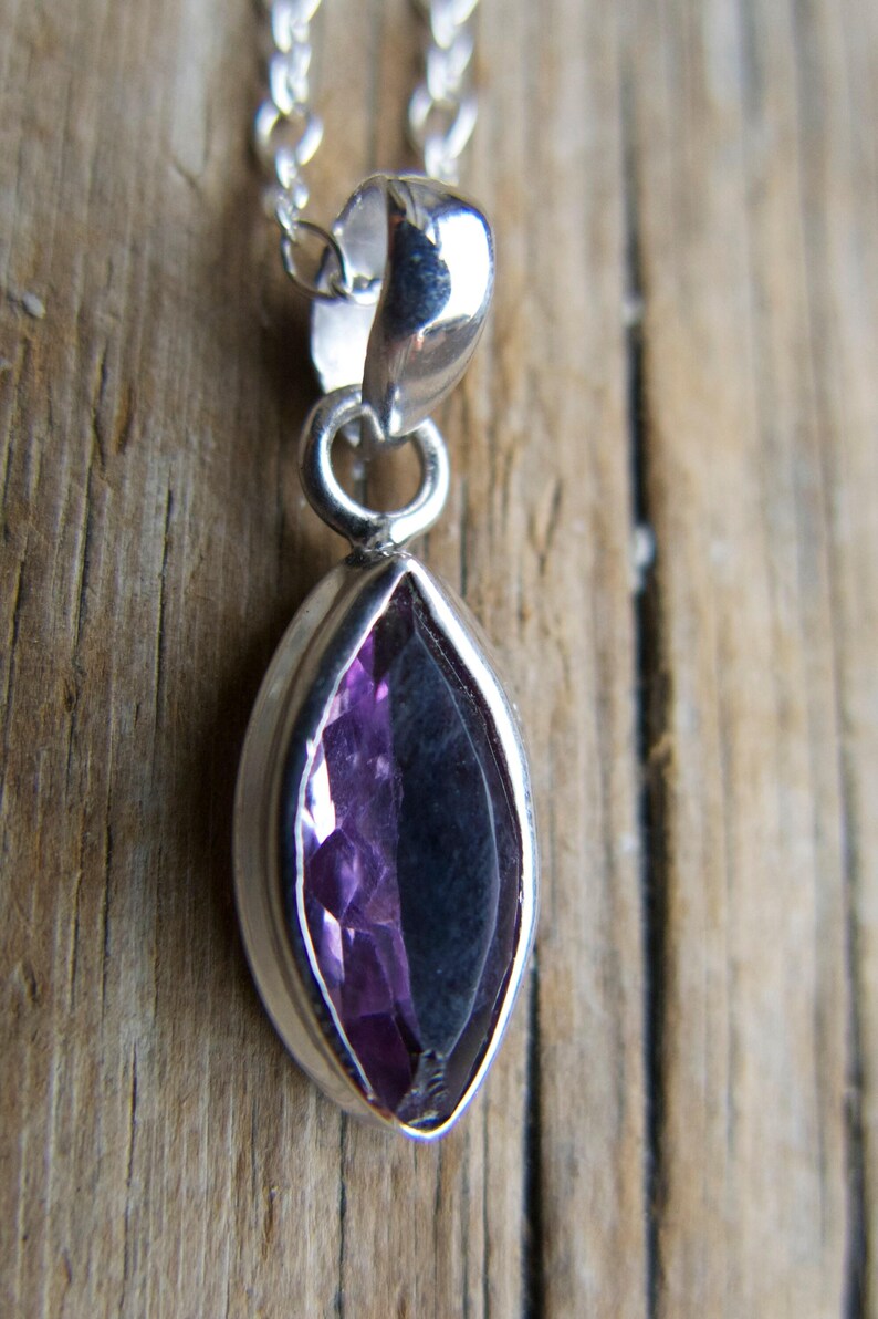 Amethyst pendant necklace: sterling silver bezel, February birthstone, dainty oval-cut stone on a delicate chain.