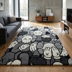 May include: A rectangular area rug featuring a repeating pattern of cartoon-style characters with X-shaped eyes and gloved hands covering their faces. The design is rendered in a monochromatic palette of black, white, and various shades of gray.