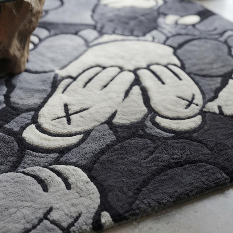 Luxury hand tufted New Zealand wool rug featuring a bold monochrome contemporary character-inspired design in black, white, and grey. Plush carved texture adds depth and softness while creating a modern artistic statement for living rooms, bedrooms, offices, and stylish interiors with premium handcrafted quality.