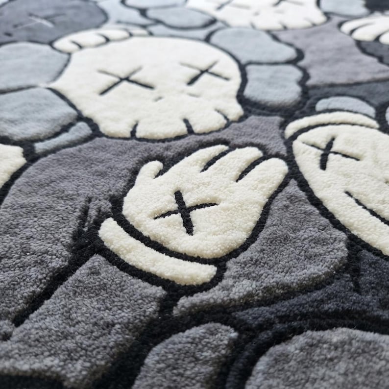 Luxury hand tufted New Zealand wool rug featuring a bold monochrome contemporary character-inspired design in black, white, and grey. Plush carved texture adds depth and softness while creating a modern artistic statement for living rooms, bedrooms, offices, and stylish interiors with premium handcrafted quality.