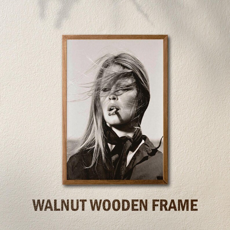 May include: Black and white framed print of a woman with long hair and a cigarette. The image is in a walnut wooden frame. The text "WALNUT WOODEN FRAME" is at the bottom of the image.