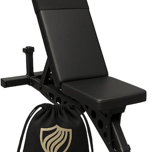 May include: A black adjustable weight bench with a padded seat and backrest, featuring a metal frame with circular cutouts. In front of the bench sits a black drawstring storage bag with a gold shield logo and the text IRUNVEN printed on the front.
