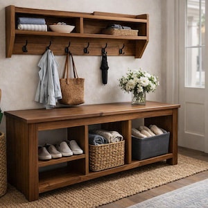 May include: A wooden entryway bench with a shelf and hooks. The bench has shoe storage and a shelf above with storage. A woven umbrella stand and a vase of flowers are also present.