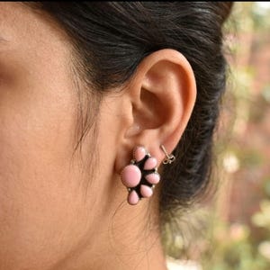 May include: A set of three ceramic mugs with a speckled, matte finish. The mugs are in shades of cream, light gray, and dark gray. Each mug has a simple, minimalist design, perfect for coffee or tea.