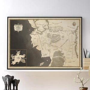 May include: Framed map of Middle-earth with the text "Beleriand Middle Earth". The map is in sepia tones and is displayed on a white shelf above a wooden desk. A globe and decorative items are also on the desk.
