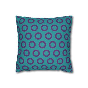 May include: Square cushion with a teal background and a repeating pattern of purple circles. The cushion is a decorative item, likely for a bed or sofa, and features a simple, modern design.