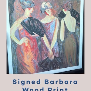 May include: A framed wood print featuring three figures in elegant gowns, each holding a black fan. The artwork uses a palette of reds, purples, and browns, with the text "Signed Barbara Wood Print" at the bottom.