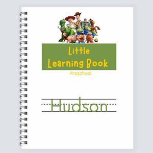 May include: A spiral-bound learning book with the text "Little Learning Book Preschool" and the name "Hudson" in green. The cover features characters from the Toy Story movie.