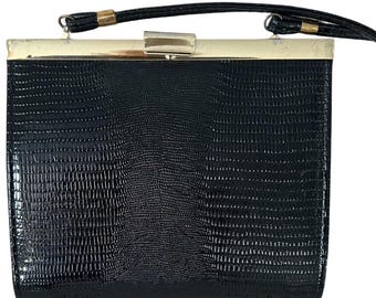 Bolso de noche vintage negro con relieve de lagarto.