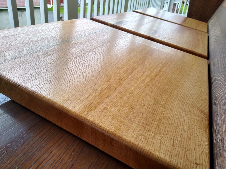 May include: Three wooden tabletops with a smooth, polished finish. The tabletops are made of light brown wood with a natural grain pattern.