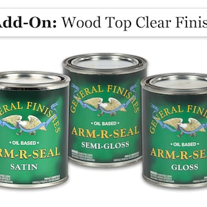 May include: Three cans of General Finishes Arm-R-Seal wood finish in satin, semi-gloss, and gloss. Each can is green with a gold eagle logo and the text "Oil Based".
