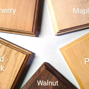 May include: Five wood samples, each with a different wood type labeled: Cherry, Maple, Red Oak, Walnut, and Pine.