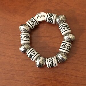 White beaded "Hope" bracelet