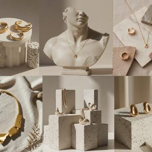 May include: A collection of gold-toned jewelry, including rings, necklaces, and earrings, displayed on textured pedestals and a draped surface. The jewelry has a modern, minimalist design. A bust of a classical figure is also featured.