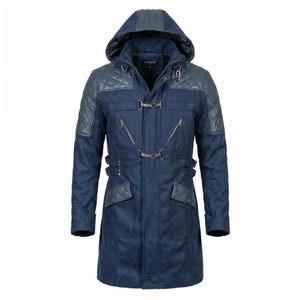 May include: A navy blue hooded coat with quilted shoulder and hood accents. The coat features a toggle closure, multiple pockets, and zipper details. The coat has a long length and a tailored fit.