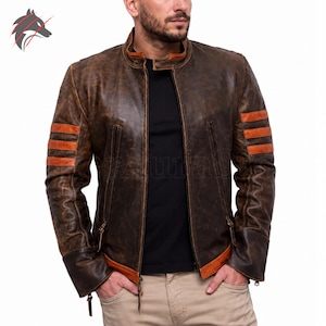 May include: A distressed brown leather jacket featuring a mandarin collar, a central zipper closure, and three horizontal orange stripes on each upper sleeve. The jacket includes vertical zippered pockets and orange trim at the hem and cuffs.