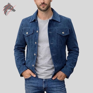 May include: A blue suede jacket with a button-up front, two chest pockets, and silver buttons. The jacket has a classic collar and is worn over a gray t-shirt and blue jeans. The jacket is a stylish outerwear option.