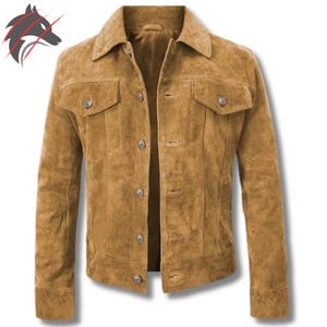 May include: A tan suede jacket with a classic design. The jacket features a collared neckline, button-down closure, two chest pockets, and buttoned cuffs. The jacket is a neutral color and has a tailored fit.