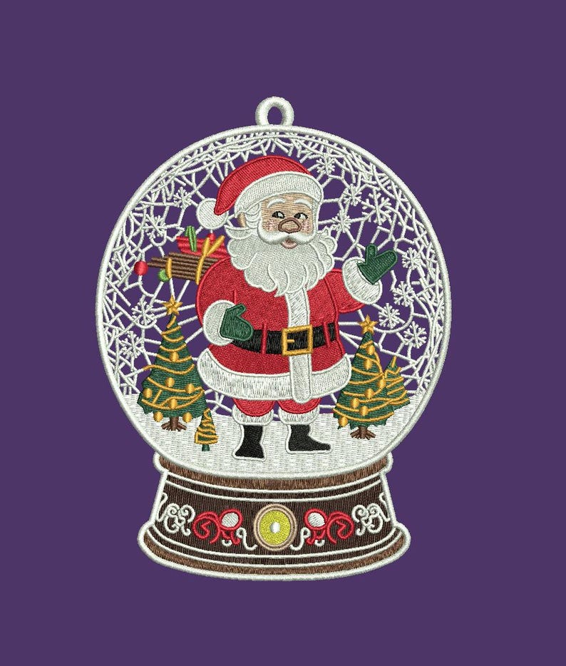 May include: Embroidered Christmas ornament featuring Santa Claus inside a snow globe. Santa wears a red suit, black boots, and green gloves. The snow globe has a white filigree design with two Christmas trees and a brown base. The background is purple.