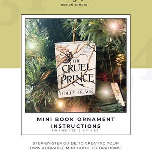 May include: A miniature book ornament of "The Cruel Prince" by Holly Black, displayed on a Christmas tree. The ornament measures 5.08 cm x 7.62 cm x 0.95 cm and features the book cover art. The image also includes text that says "Mini Book Ornament Instructions".