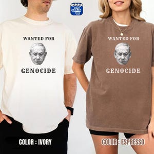 May include: Ivory and espresso-colored t-shirts with the text "WANTED FOR GENOCIDE" above a grayscale portrait. The ivory shirt is on the left, and the espresso shirt is on the right. The brand logo is in the top right corner.
