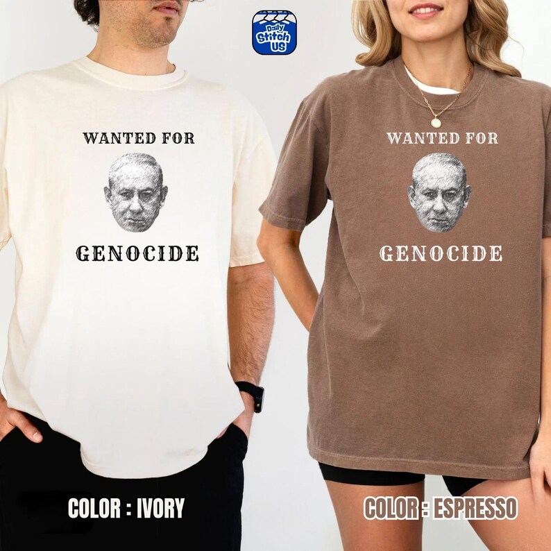 May include: Ivory and espresso-colored t-shirts with the text "WANTED FOR GENOCIDE" above a grayscale portrait. The ivory shirt is on the left, and the espresso shirt is on the right. The brand logo is in the top right corner.
