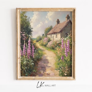 Könnte beinhalten: Gerahmtes Landschaftsgemälde, das ein Cottage mit rotem Ziegeldach und Steinmauern zeigt. Ein Weg schlängelt sich durch einen Garten mit rosa und lila Blumen. Das Kunstwerk ist mit "LK WALL ART" signiert.
