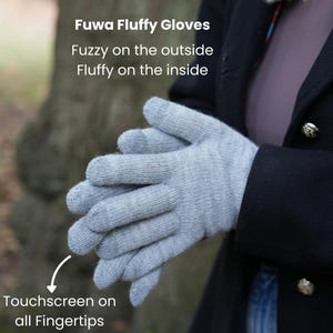 May include: Light gray Fuwa Fluffy Gloves with touchscreen fingertips. The gloves are fuzzy on the outside and fluffy on the inside. The image includes the text "Fuwa Fluffy Gloves", "Fuzzy on the outside", "Fluffy on the inside", and "Touchscreen on all Fingertips".