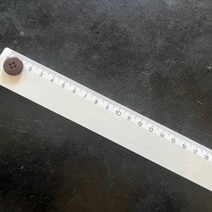 One Vintage CHANEL brown resin buttons featured on Circa 1990&#39;s