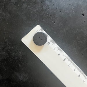 One Vintage CHANEL black matte buttons featured on Circa 1990&#39;s