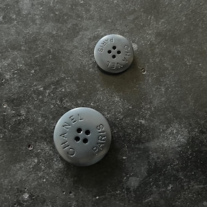 One Vintage CHANEL matte resin buttons featured on Circa 1990&#39;s
