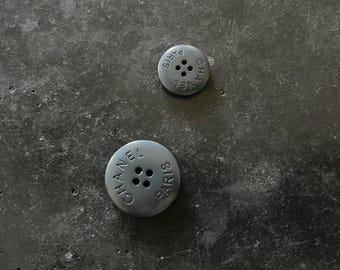One Vintage CHANEL matte resin buttons featured on Circa 1990's