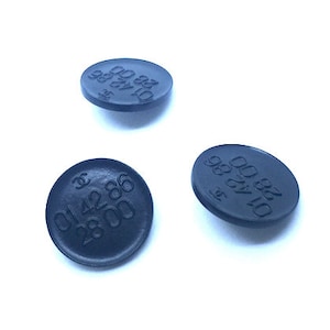 One Vintage black CHANEL RUE CAMBON boutique phone number featured on buttons