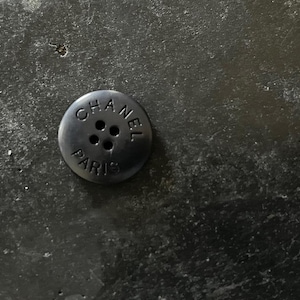 One Vintage CHANEL black resin buttons featured on Circa 1990&#39;s