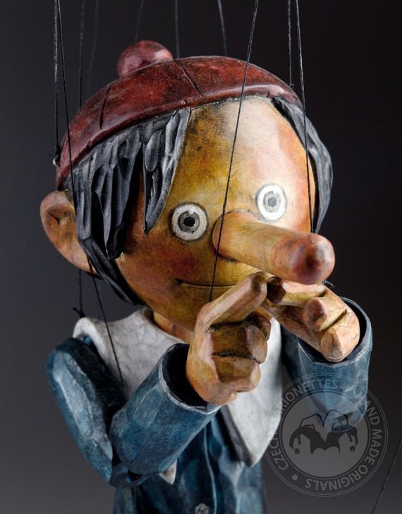 The smallest Pinocchio marionette in the world - precisely hand