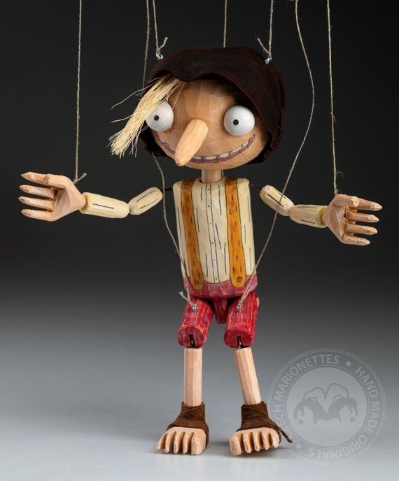 The smallest Pinocchio marionette in the world - precisely hand