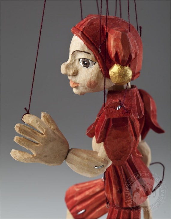 The smallest Pinocchio marionette in the world - precisely hand