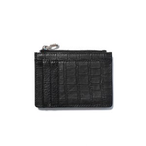 May include: Black leather cardholder with a crocodile texture. The wallet has a zippered top closure and multiple card slots. The cardholder is rectangular and has a silver zipper pull.