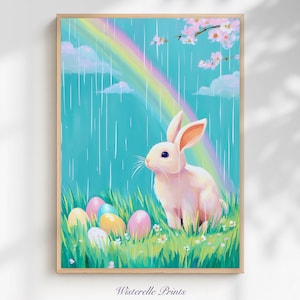 Puede incluir: Una impresión enmarcada con un conejito blanco sentado en hierba verde con coloridos huevos de Pascua. Un arcoíris cruza un cielo turquesa con lluvia, nubes y flores de cerezo. El texto "Wisterelle Prints" está en la parte inferior.