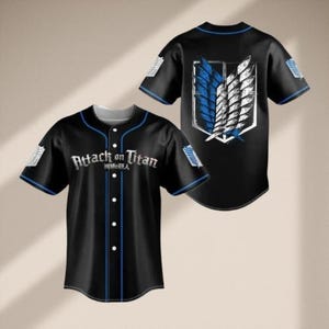 May include: Black baseball jersey with blue trim and the text "Attack on Titan" in white. The jersey features a logo on the back with blue and white wings. The jersey has short sleeves and a button-up front.