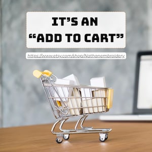 May include: A miniature shopping cart filled with white boxes, set on a wooden surface. The cart has yellow accents. Above the cart, text reads "IT'S AN 'ADD TO CART'" with a link to an Etsy shop.