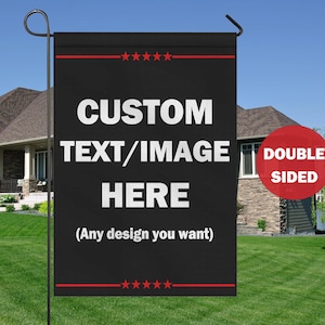 May include: Black garden flag with white text that reads "CUSTOM TEXT/IMAGE HERE" and "(Any design you want)". The flag is double-sided and has red star accents. The flag is displayed in a grassy yard.