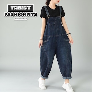 May include: Dark blue denim overalls with large front pockets and adjustable straps. The overalls have a relaxed fit and are cuffed at the ankles. The image includes the text "TRENDY FASHIONFITS" and "UNISEX FASHION FITS".