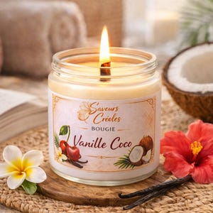 May include: A lit candle in a glass jar, labelled "Saveurs Cr&eacute;oles Bougie Vanille Coco". The candle is surrounded by a coconut half, flowers, and vanilla pods. The candle has a vanilla and coconut scent.