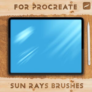 May include: A digital tablet with a blue screen displaying sun ray brushes. The tablet is on a wooden surface, with the words "FOR PROCREATE" and "SUN RAYS BRUSHES" carved into the wood. A white stylus is positioned to the right of the tablet.