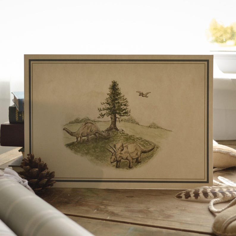 May include: A framed print featuring a watercolor illustration of a prehistoric scene. Two dinosaurs graze near a tree, with a flying reptile overhead. The artwork has a vintage aesthetic, with a brown and green color palette.