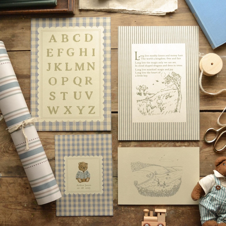 May include: A collection of children's stationery and decor items, including alphabet cards, illustrated storybook pages, and a teddy bear card. The items feature a blue and white gingham and striped pattern, with a vintage aesthetic.