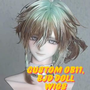May include: A doll head with a custom wig. The wig features a blend of colors, including mint green, brown, and silver. The text "CUSTOM OB11, BJD DOLL WIGS" is displayed in yellow and red. The doll is wearing a silver necklace.